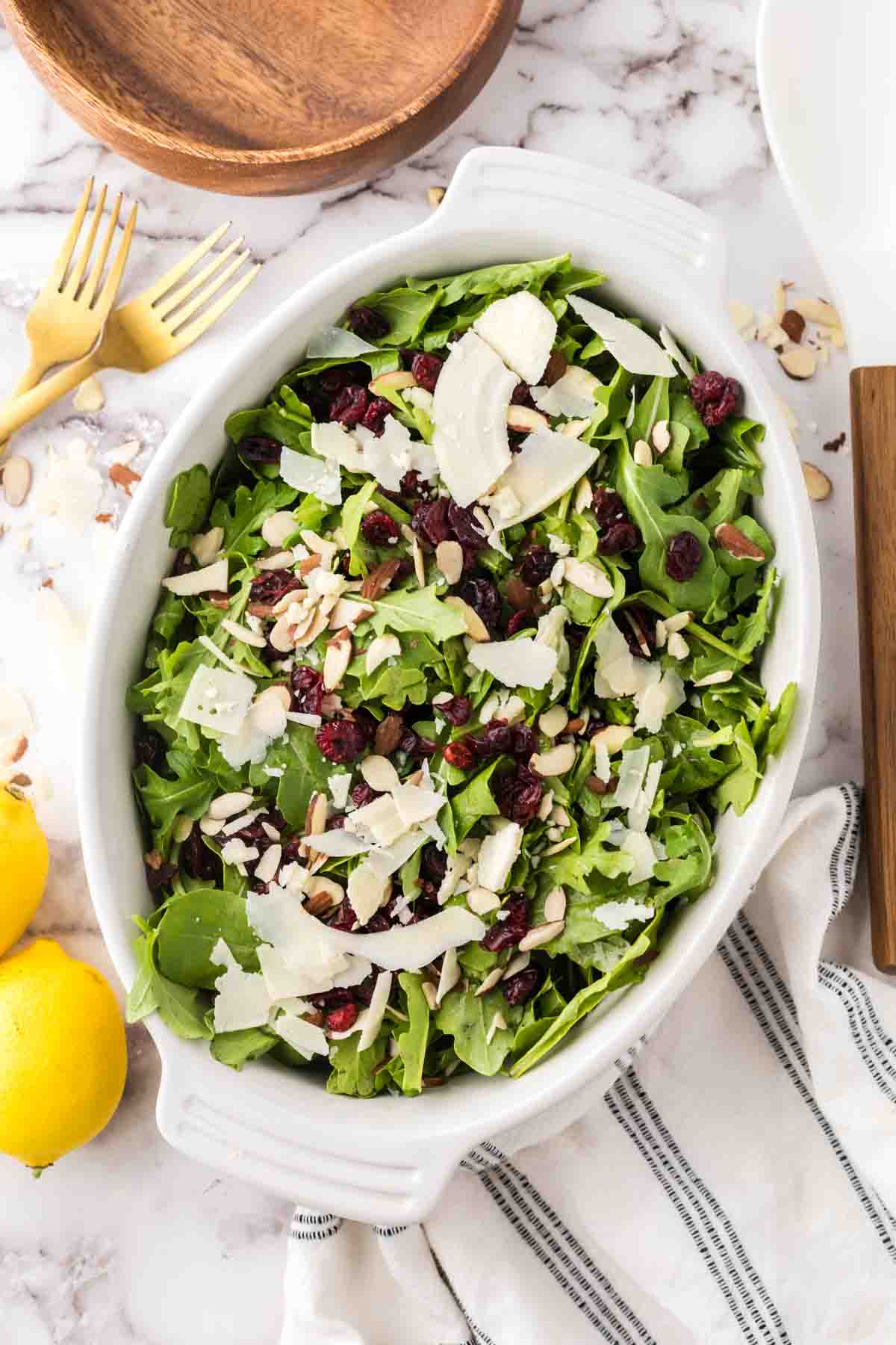 arugula salad recipe in a white oval serving dish.