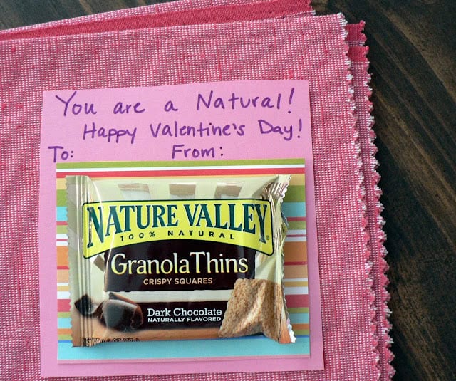 A package of Nature Valley granola things attached to a piece of paper that says You are a natural happy valentines day. 
