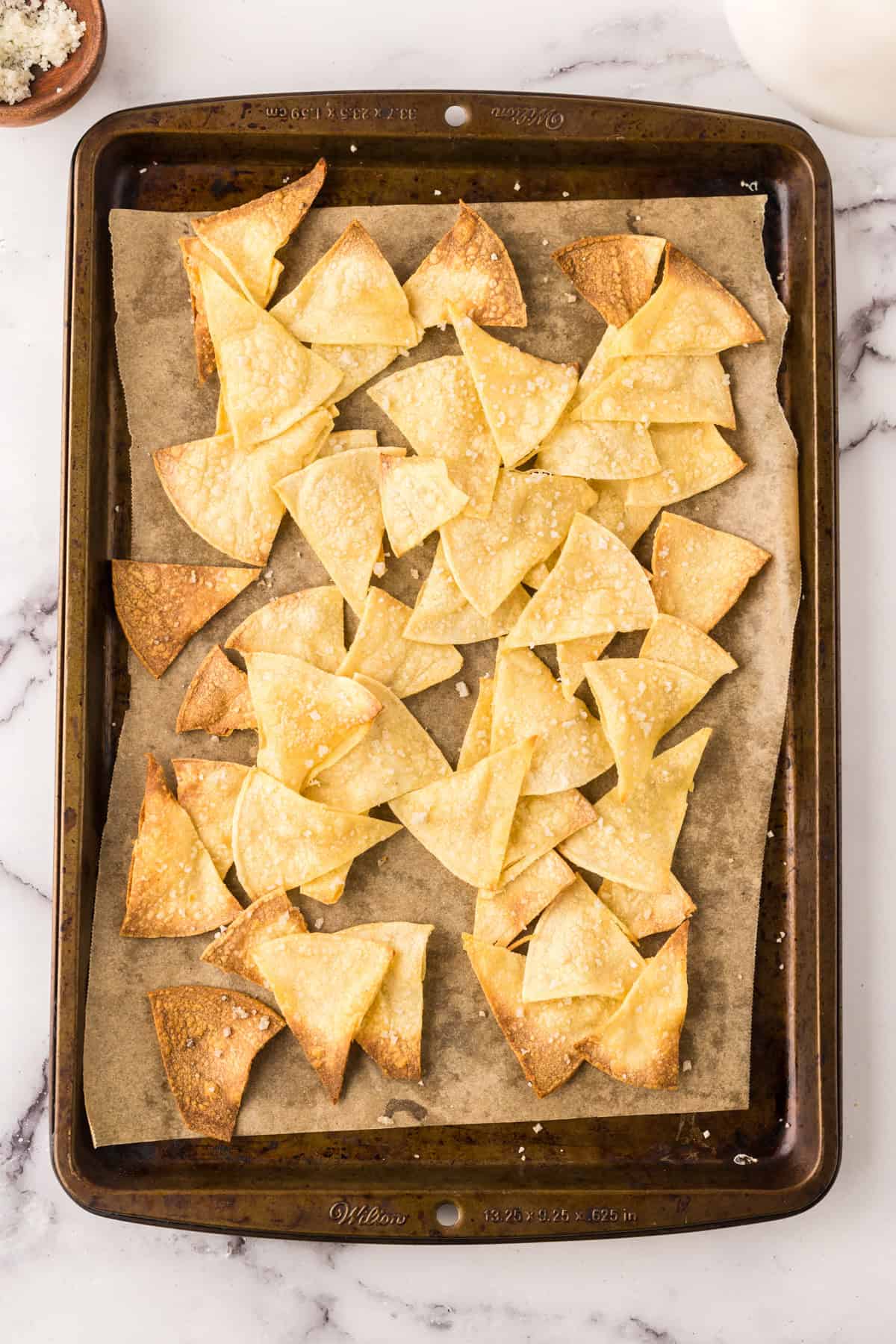 a sheet cake with baked tortilla chips fresh out of the oven.