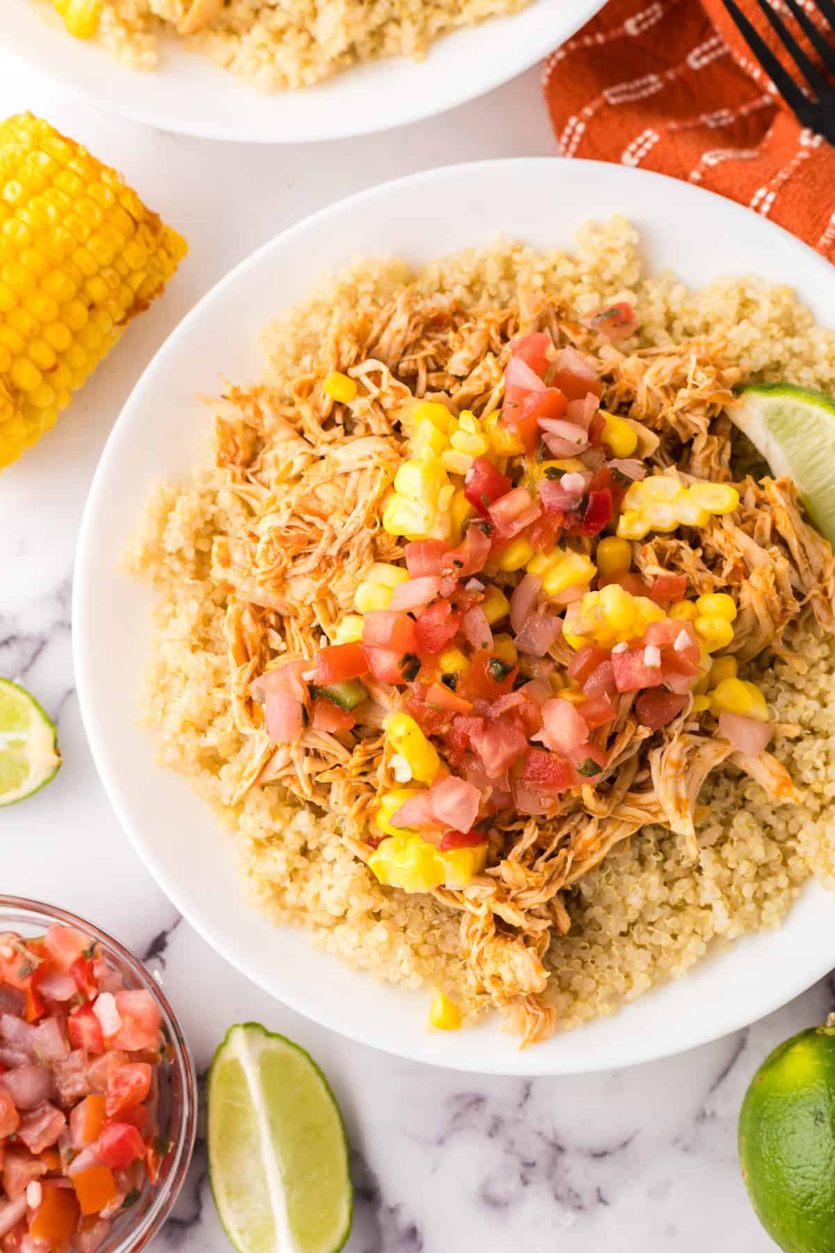 round white plate with the chipotle chicken burrito bowl recipe.