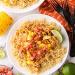 round white plate with the chipotle chicken burrito bowl recipe.
