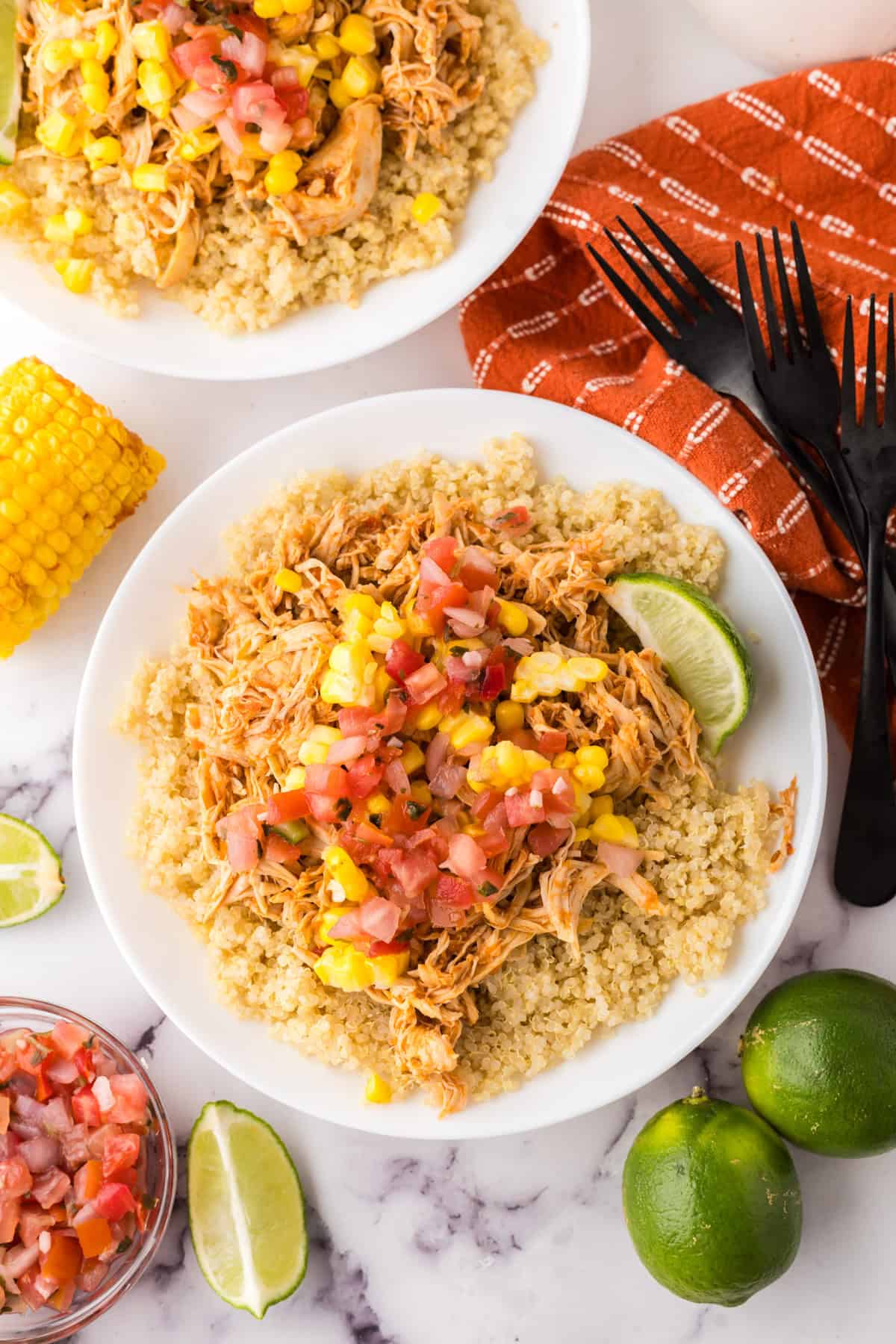 round white plate with the chipotle chicken burrito bowl recipe.