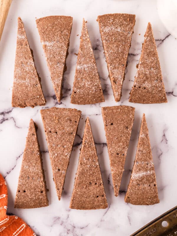 wedge slices of the chocolate shortbread recipe on a marble counter top.