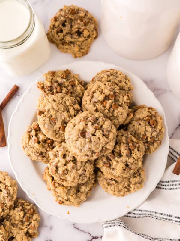 round white plate piled with cinnamon chip oatmeal cookies.