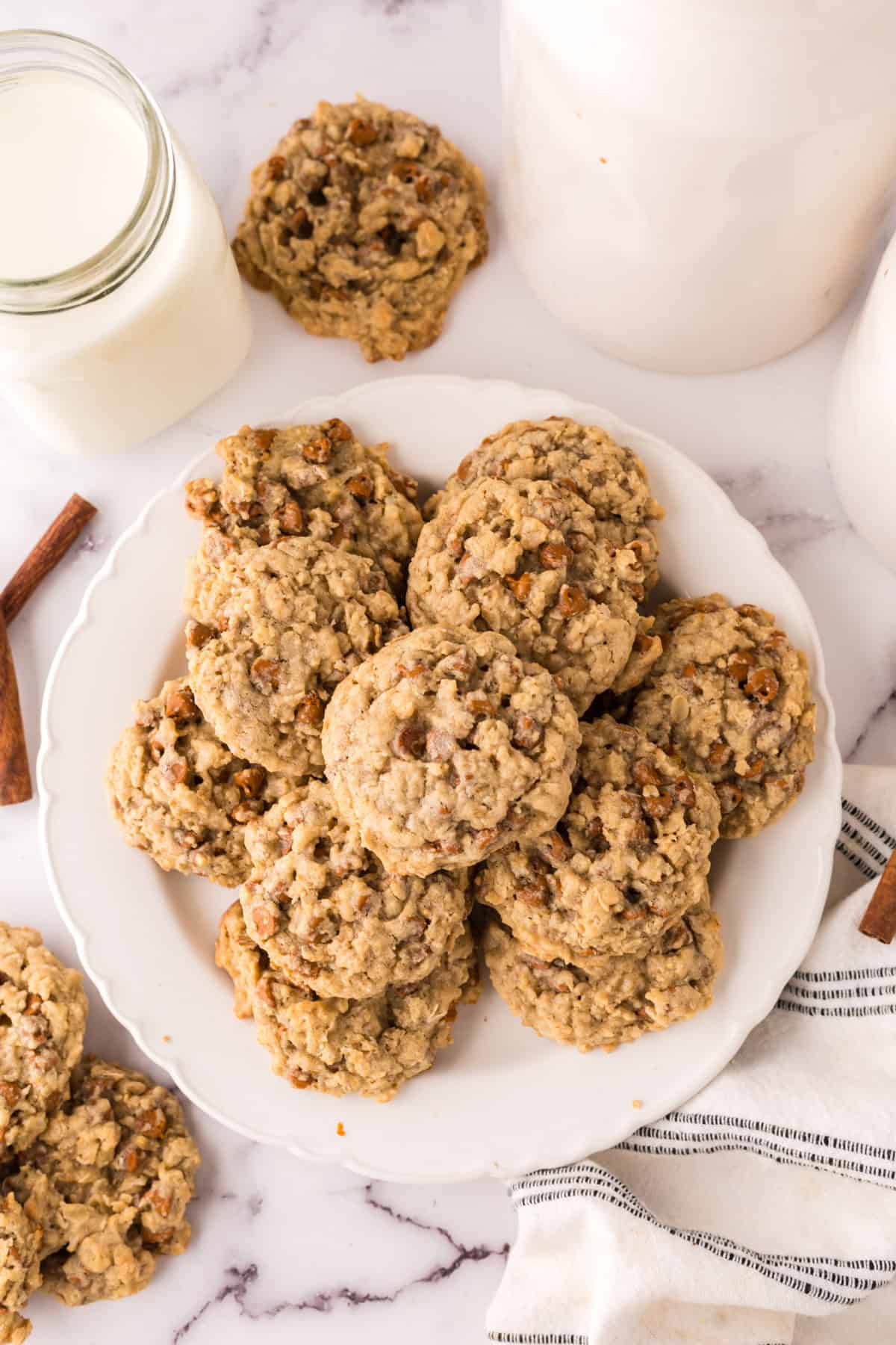 round white plate piled with cinnamon chip oatmeal cookies.