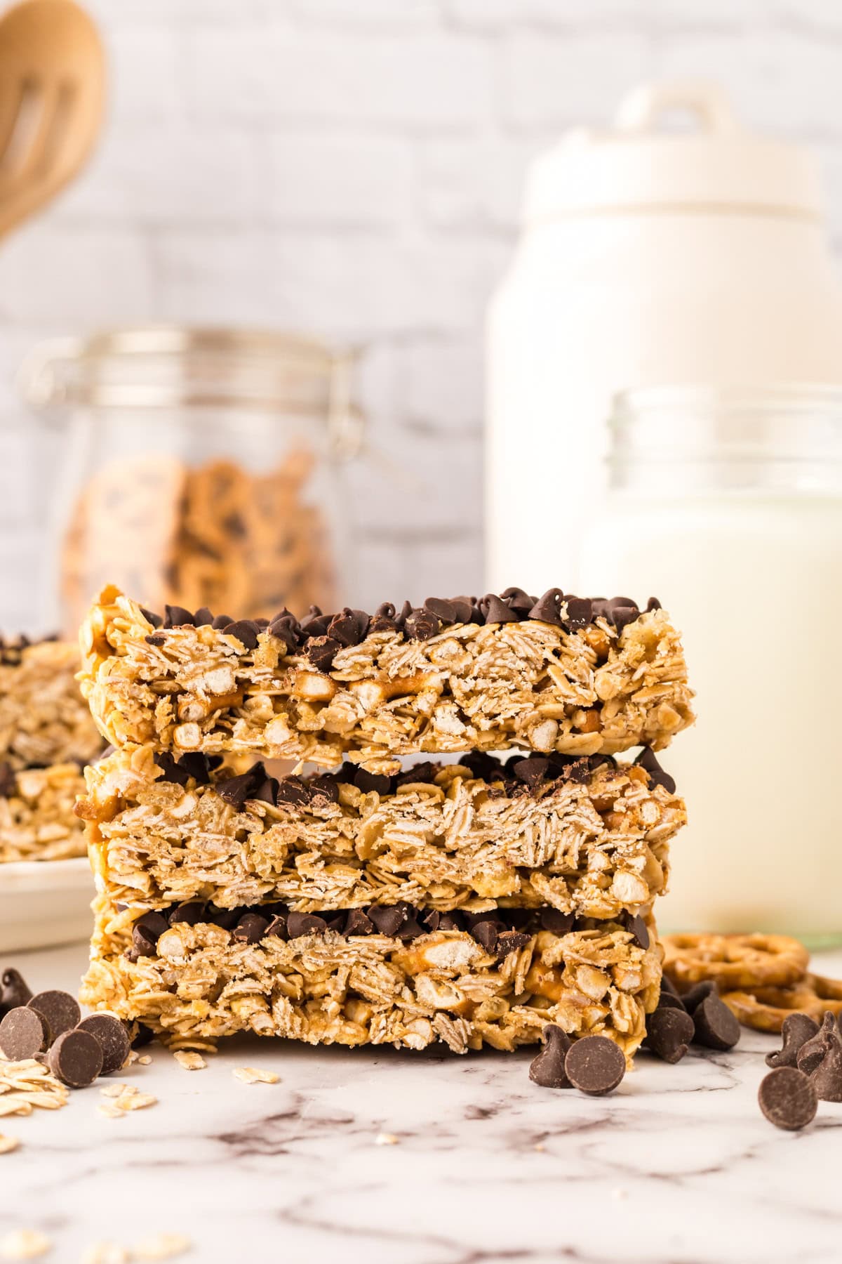 a stack of three homemade granola bars with chocolate chips.