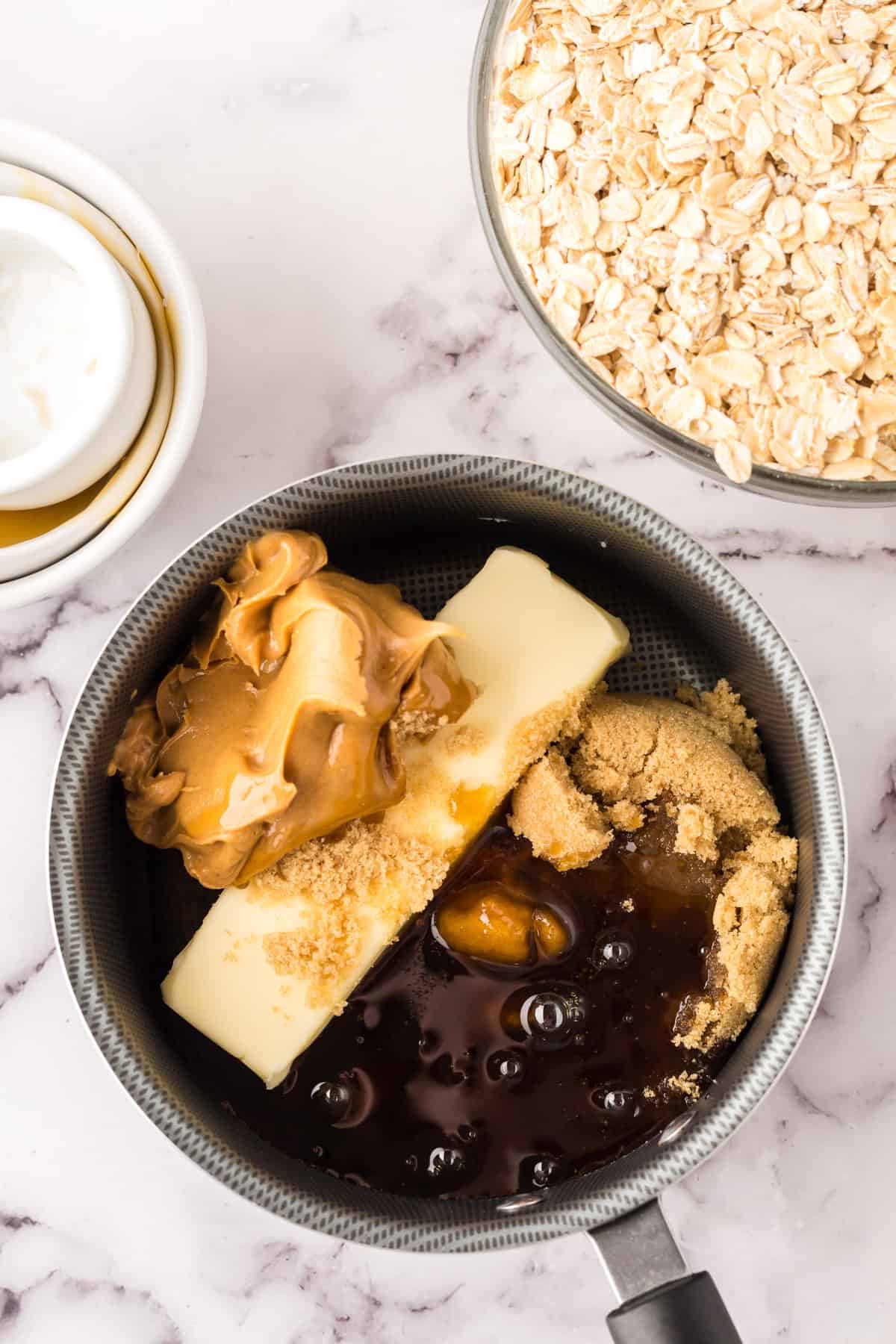 sauce pan with ingredients for making the homemade granola bar recipe.