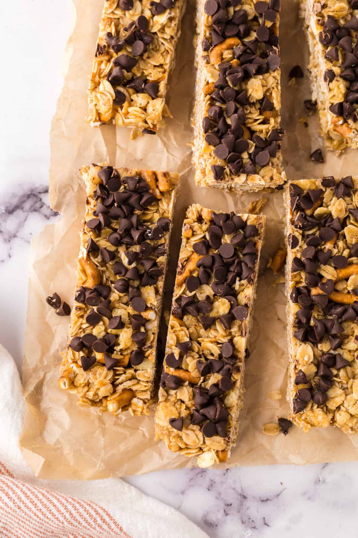 rectangle pieces of the homemade granola bar recipe over parchment paper.