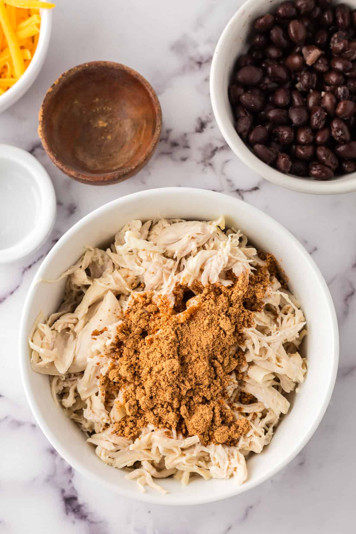 shredded chicken in a bowl ready for the skillet chicken nacho recipe.