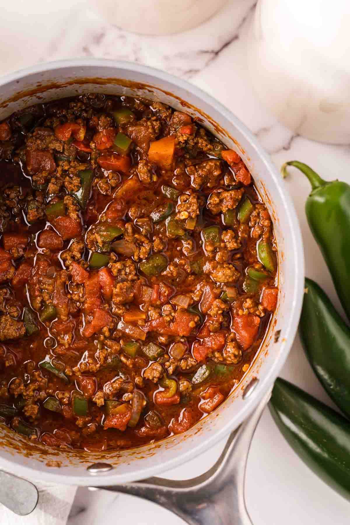 soup pan with the process of making Texas chili.
