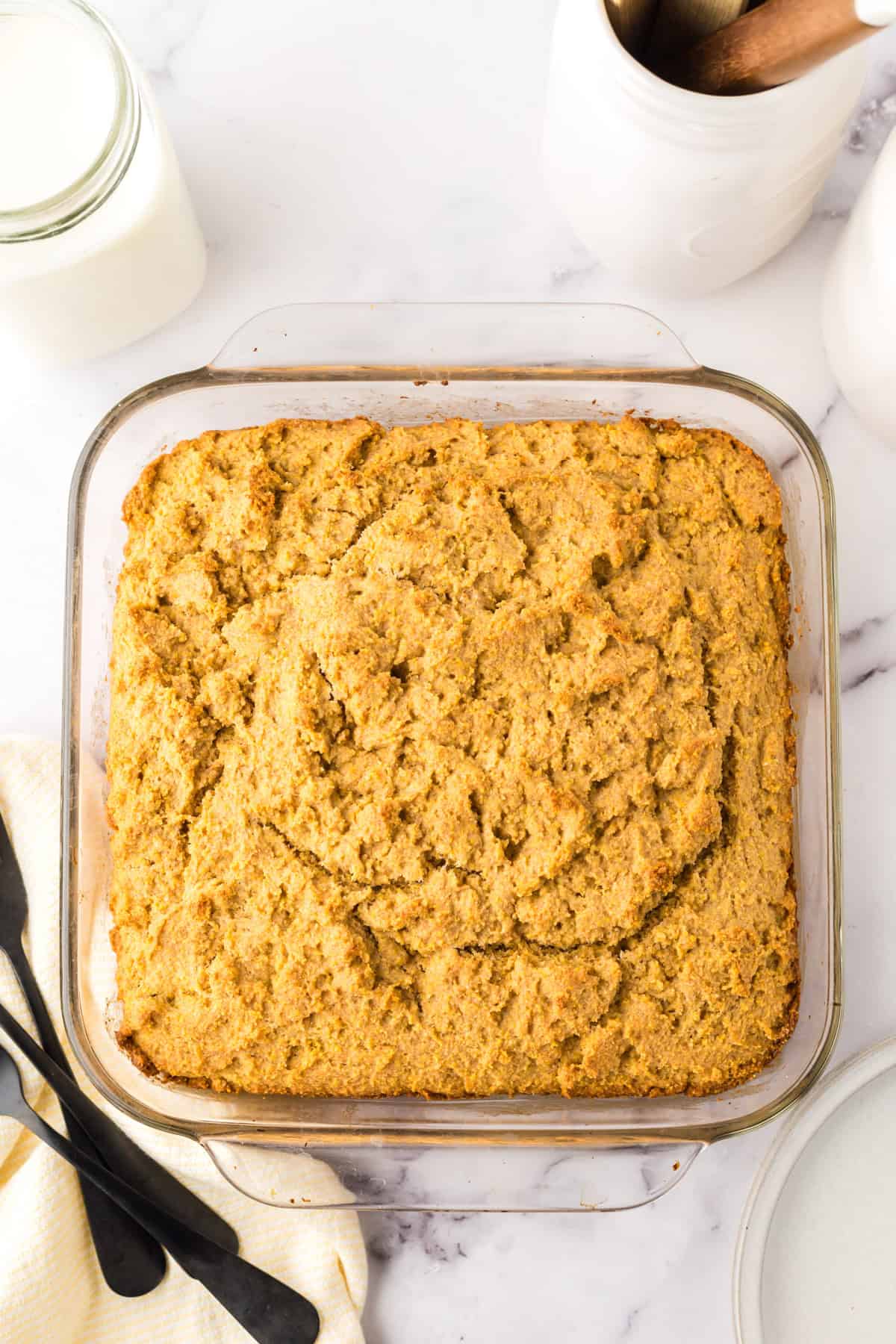 clear baking dish with whole wheat cornbread fresh out of the oven.