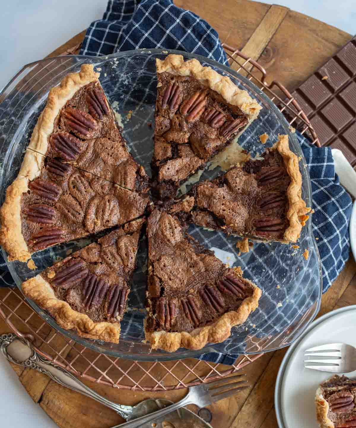 chocolate pecan pie in a clear pan.