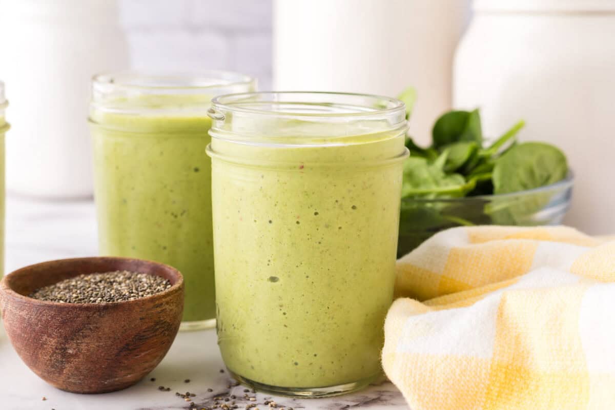 Green smoothie in a wide mouth mason jar.
