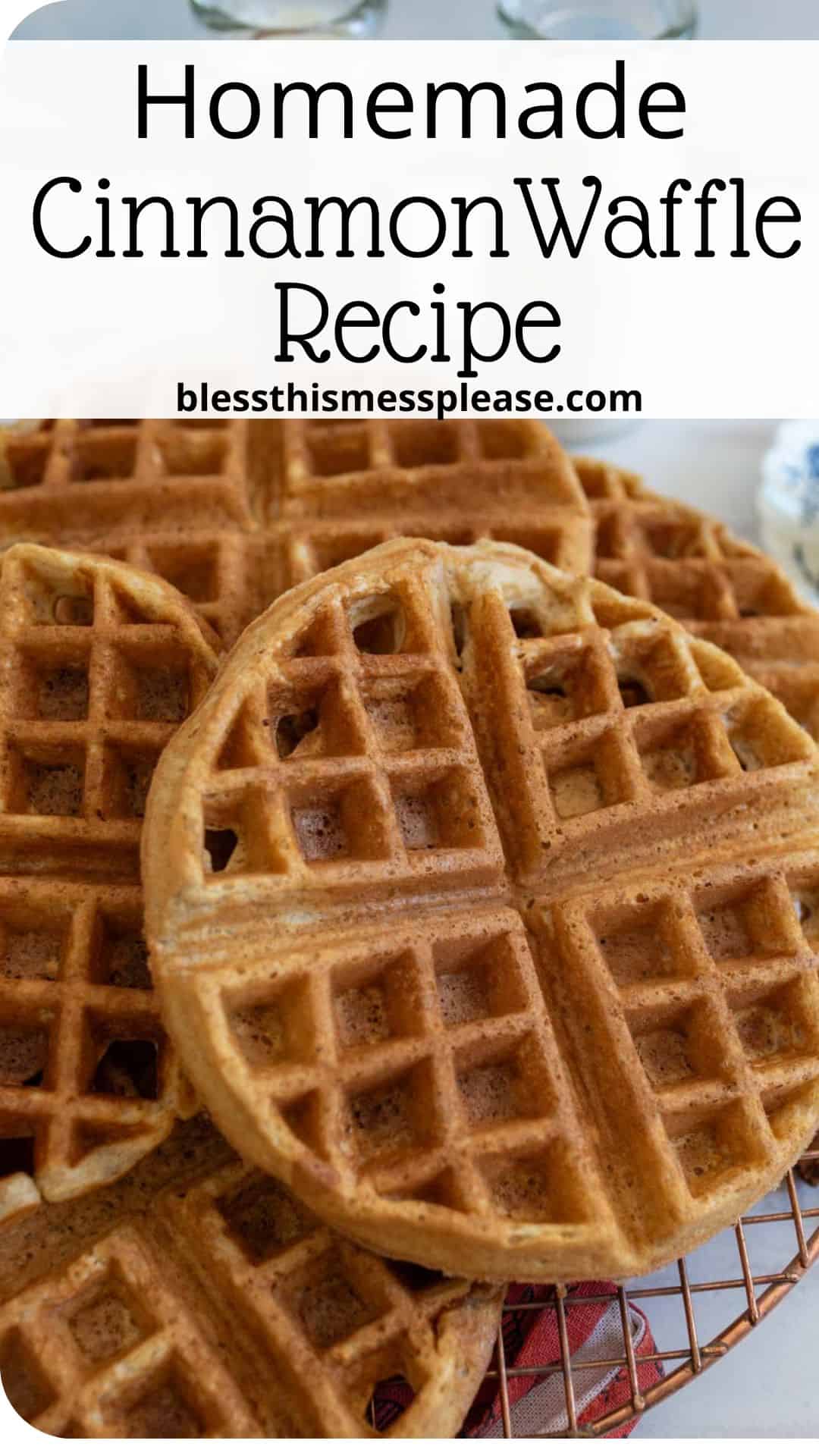 Close-up of freshly made cinnamon waffles on a cooling rack. The waffles are golden brown and have a classic grid pattern. In the top part of the image, text reads: Homemade Cinnamon Waffle Recipe and blessthismessplease.com.