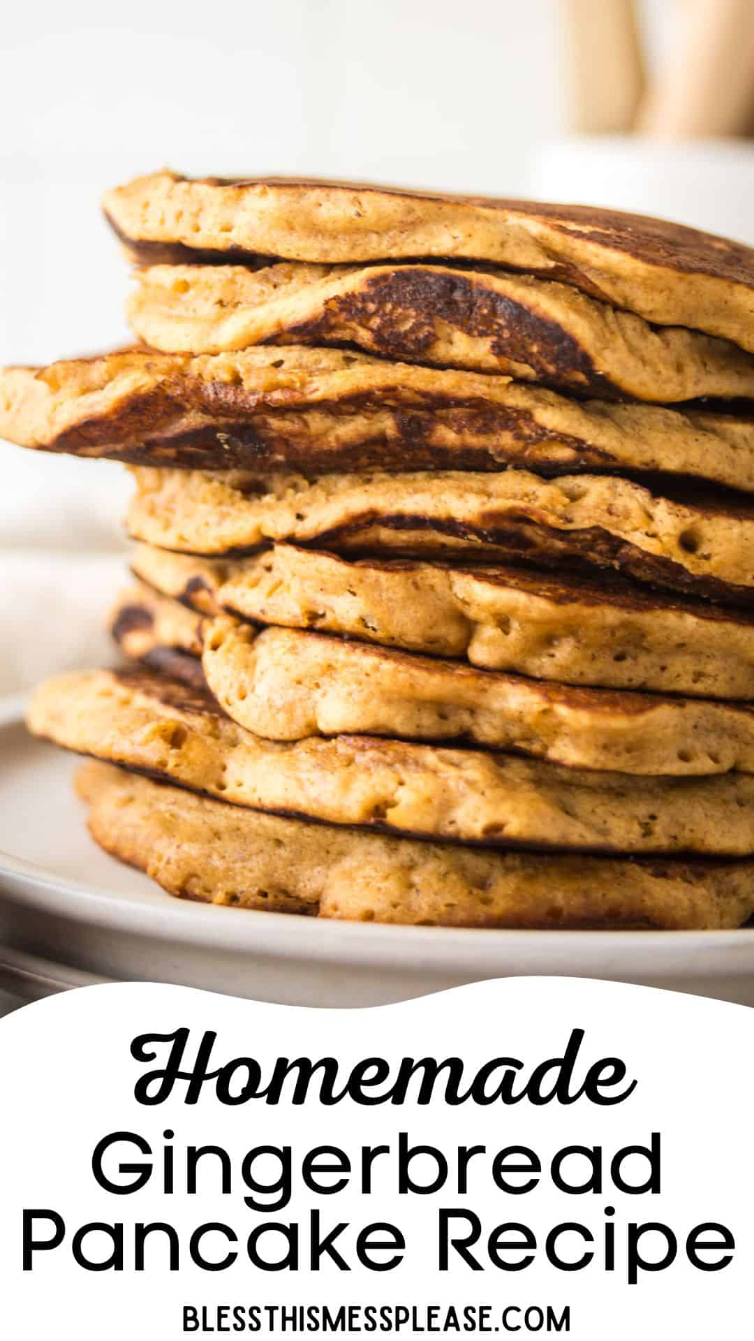 A stack of fluffy homemade gingerbread pancakes with visible spices, on a white plate. The text below reads Homemade Gingerbread Pancake Recipe from blessthismessplease.com.