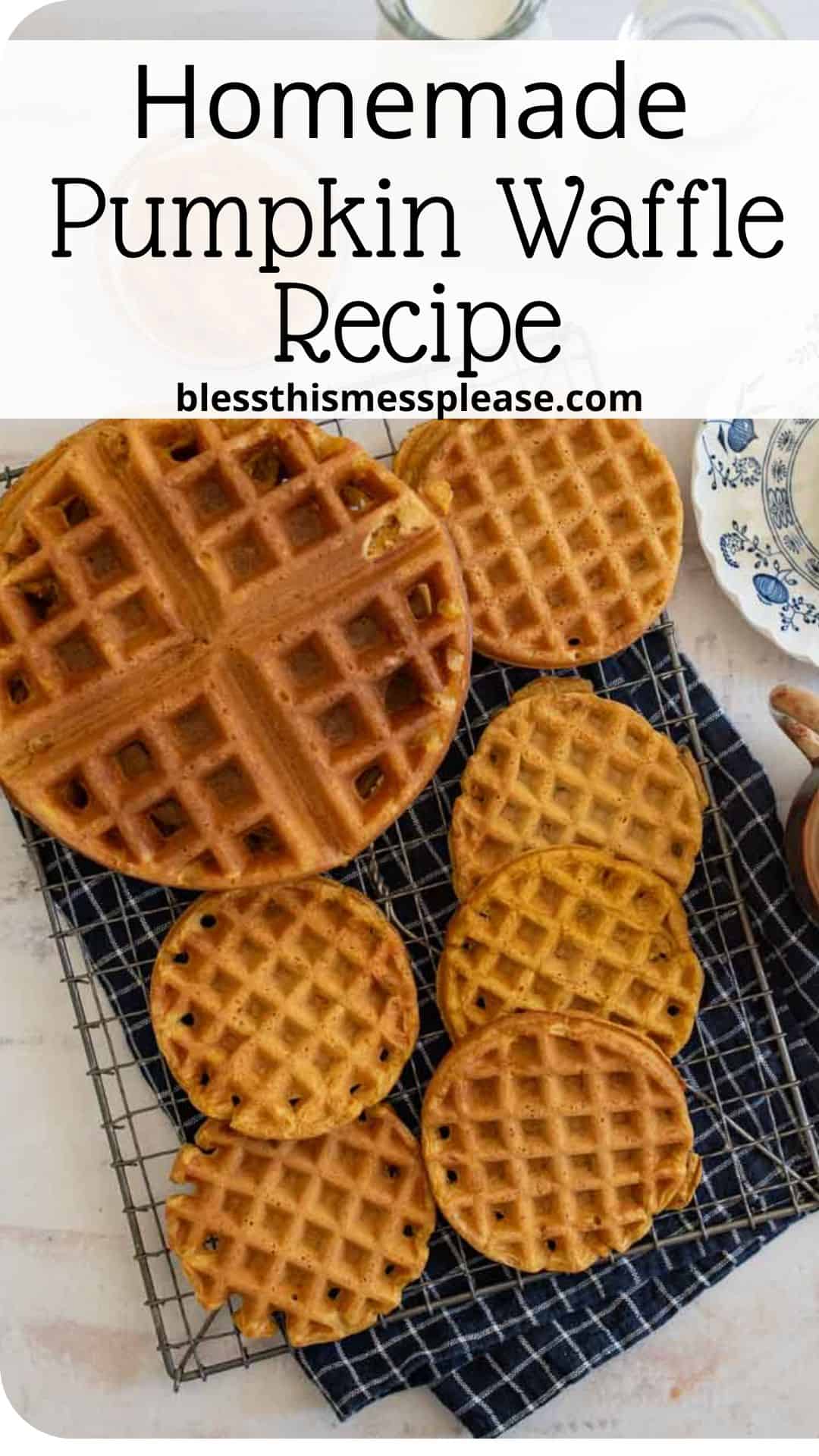 A selection of pumpkin waffles is displayed on a cooling rack, with a variety of sizes arranged neatly. A small striped cloth and a blue floral plate are visible on the side. Text at the top reads, Homemade Pumpkin Waffle Recipe blessthismessplease.com.
