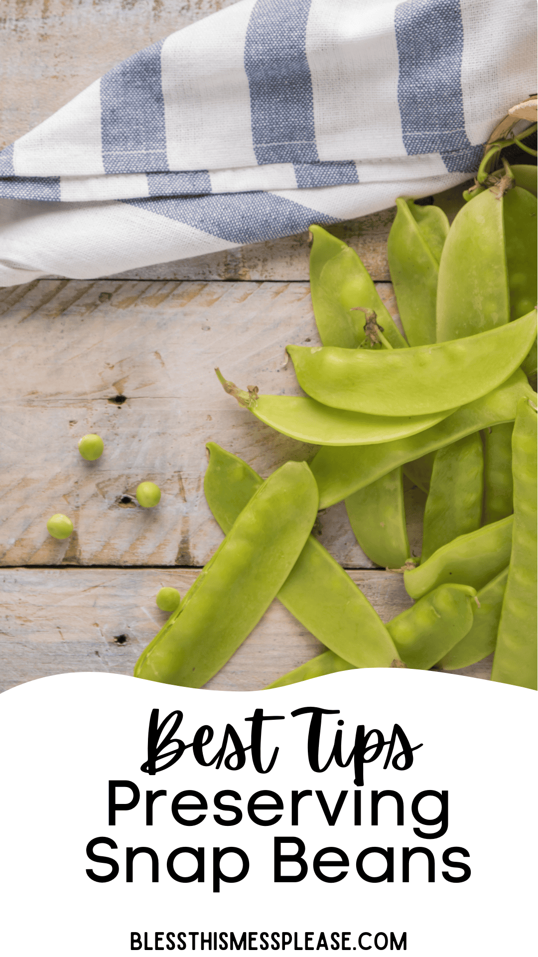 A handful of fresh green snap beans and a few loose peas rest on a rustic wooden surface, next to a blue-and-white striped cloth. Text overlay reads: Best Tips Preserving Snap Beans. blessthismessplease.com.