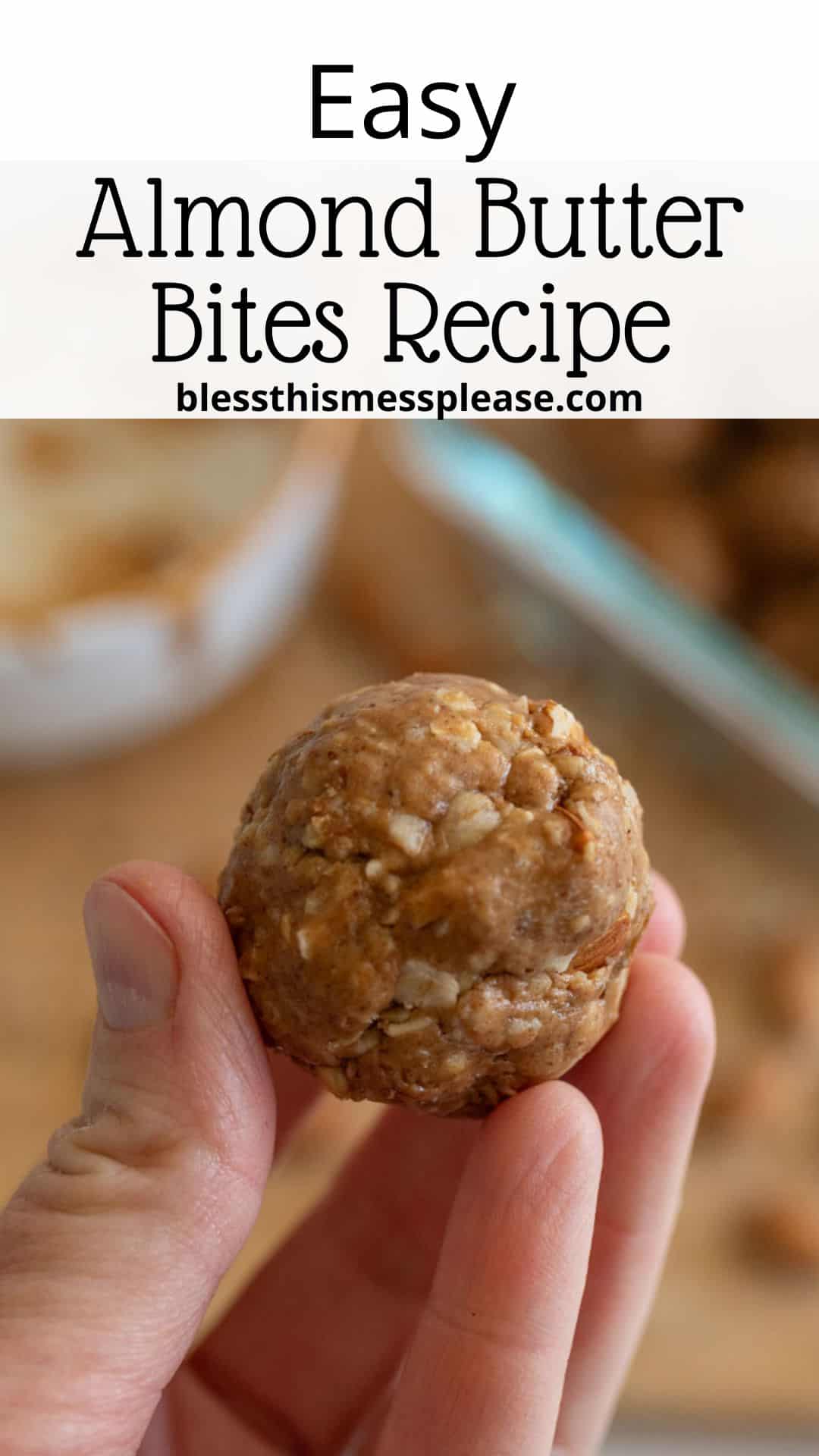 Close-up of a hand holding a round almond butter bite with text above reading Easy Almond Butter Bites Recipe and the website URL blessthismessplease.com below the recipe title.