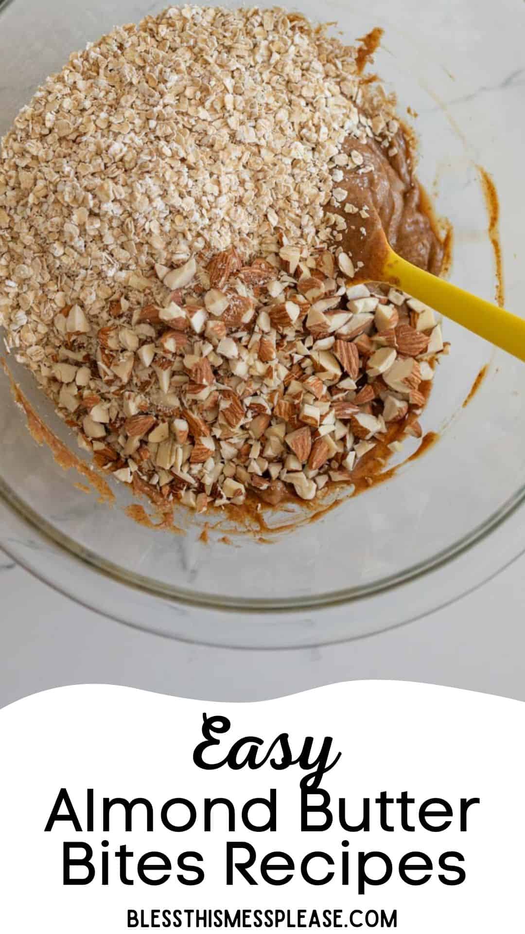 A mixing bowl with oats, chopped almonds, and almond butter. A yellow spatula is in the bowl. Text on the image reads, Easy Almond Butter Bites Recipes. Website: Blessthismessplease.com.