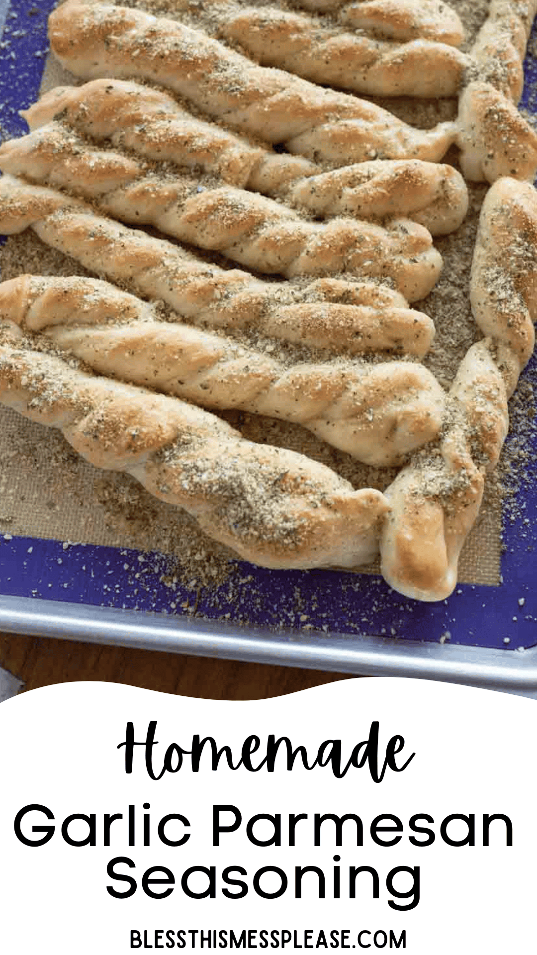 A tray of twisted breadsticks topped with rich garlic parmesan seasoning rests on a baking mat. Text at the bottom reads Homemade Garlic Parmesan Seasoning BLESSTHISMESSPLEASE.COM.