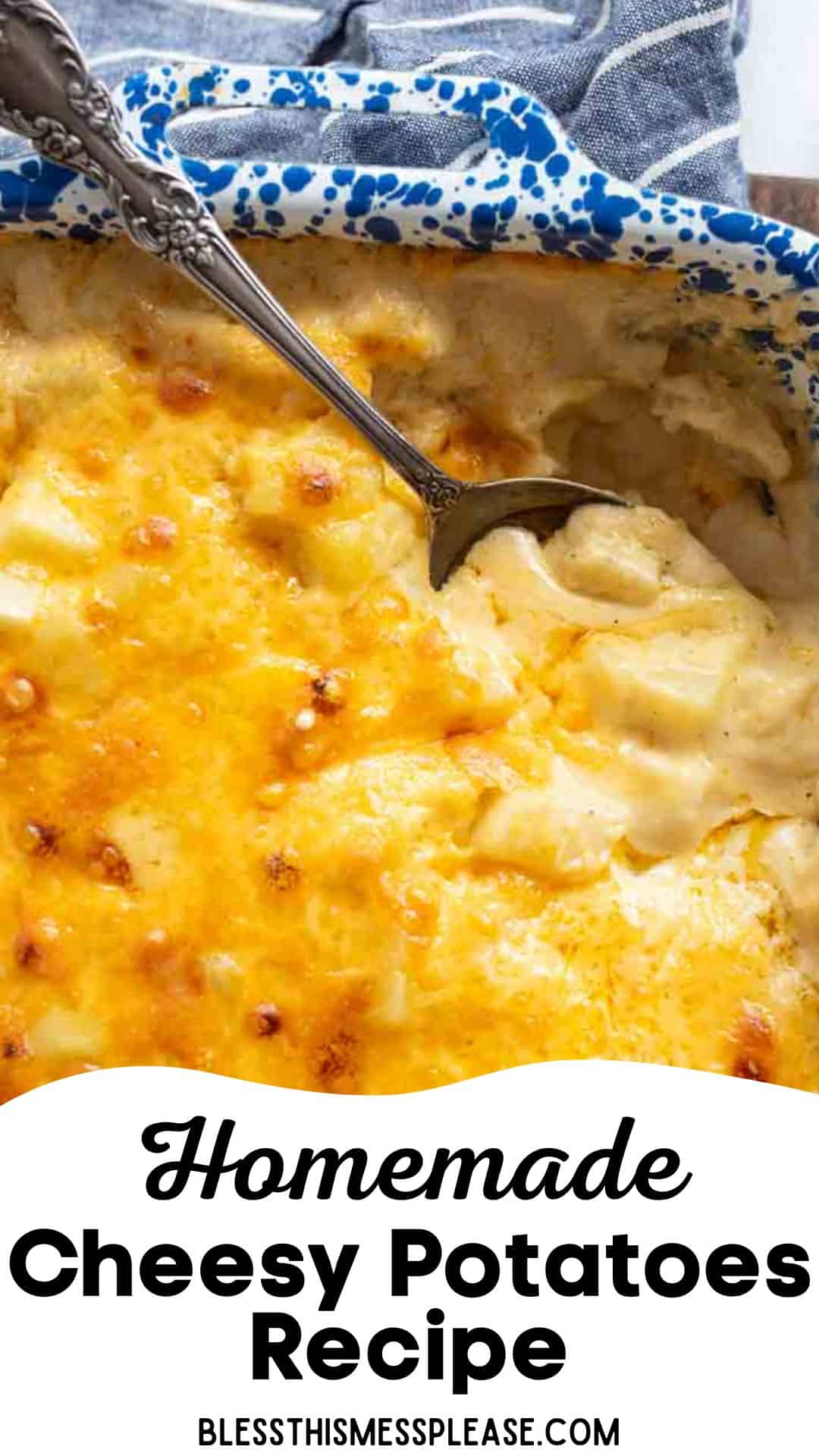 A casserole dish filled with golden, baked cheesy potatoes, with a spoon resting inside. The top is browned and bubbly. A blue and white towel is visible nearby. Text at the bottom reads: Homemade Cheesy Potatoes Recipe.
