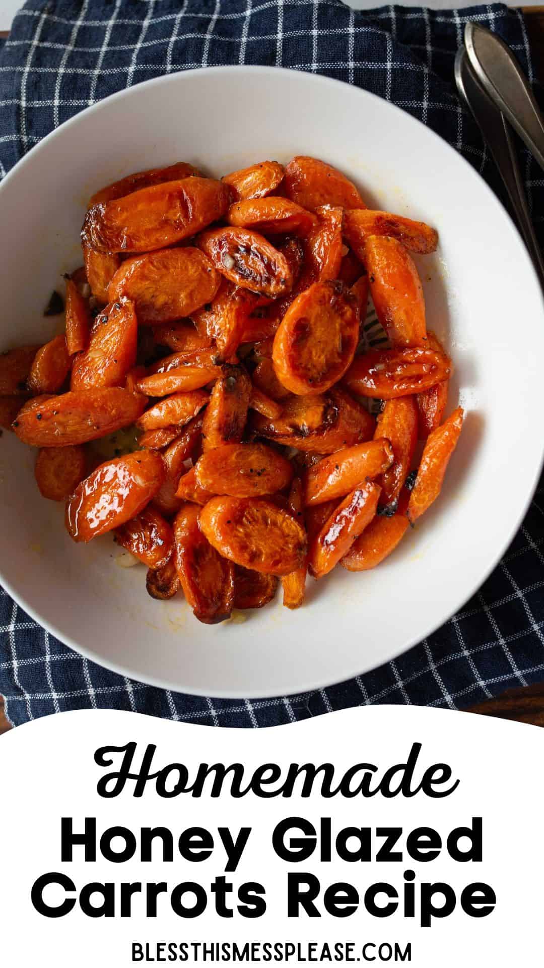 A white bowl filled with shiny, sliced honey glazed carrots sits on a blue checkered cloth, with a fork and spoon next to it. Text below the bowl reads, Homemade Honey Glazed Carrots Recipe.