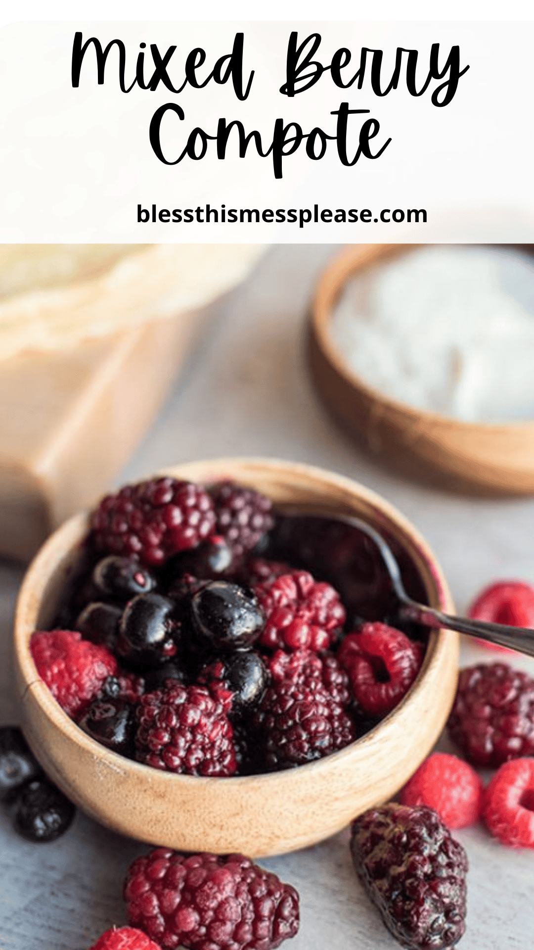 A wooden bowl filled with mixed berries, including blackberries, blueberries, and raspberries, sits on a table with a spoon. Additional berries and a bowl of cream are in the background. Text reads Berry Compote.