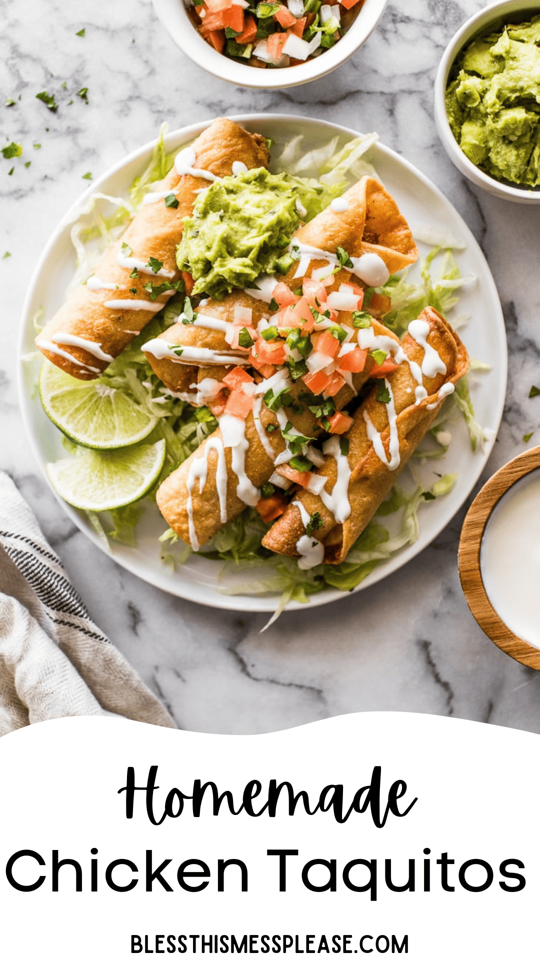 A plate of homemade chicken taquitos, made from a classic chicken taquitos recipe, is topped with guacamole, chopped tomatoes, sour cream, and fresh herbs. Lime wedges and a bed of shredded lettuce complete the dish. Guacamole and salsa bowls are nearby.