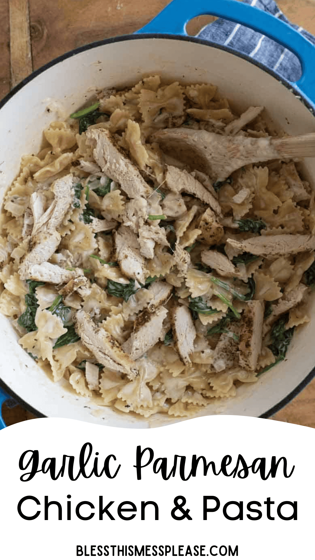 A blue pot filled with garlic parmesan chicken and pasta, bowtie noodles, spinach, and creamy sauce, with a wooden spoon. Text reads Garlic Parmesan Chicken & Pasta and blessthismessplease.com at the bottom.