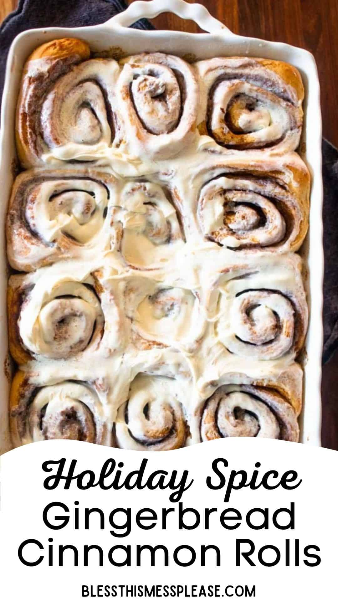 A baking dish filled with swirled gingerbread cinnamon rolls topped with icing. The text reads Holiday Spice Gingerbread Cinnamon Rolls and blessthismessplease.com at the bottom, showcasing these festive gingerbread cinnamon rolls.