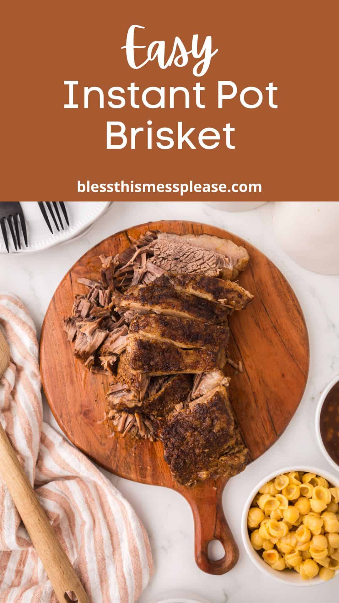 A wooden board with sliced Instant Pot Brisket sits on a table, surrounded by a bowl of macaroni and cheese, a wooden spoon, striped napkin, and sauce cups. Text above reads Easy Instant Pot Brisket with a website link.