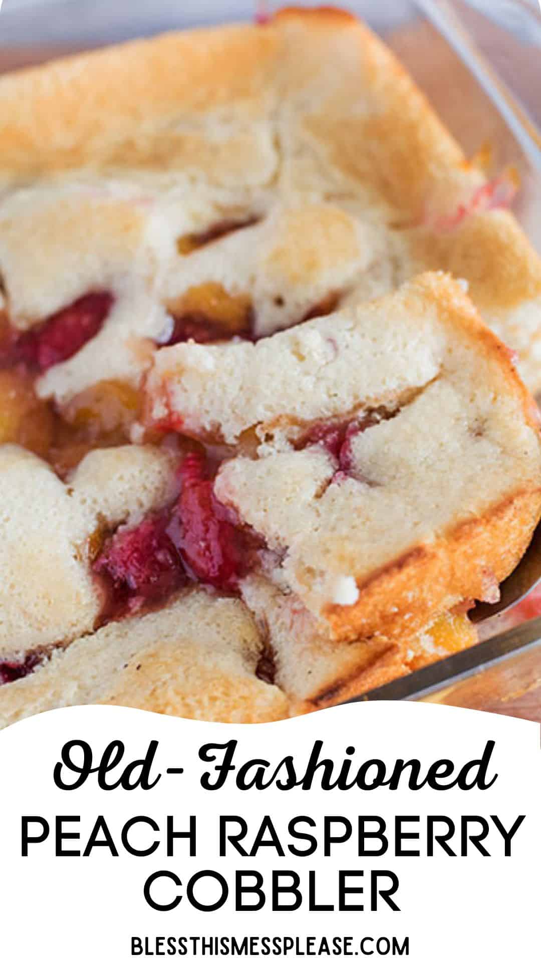 A close-up of a peach raspberry cobbler in a glass dish, showing golden-brown crust with juicy red raspberries and peach filling visible. Text overlay reads Old-Fashioned Peach Raspberry Cobbler.