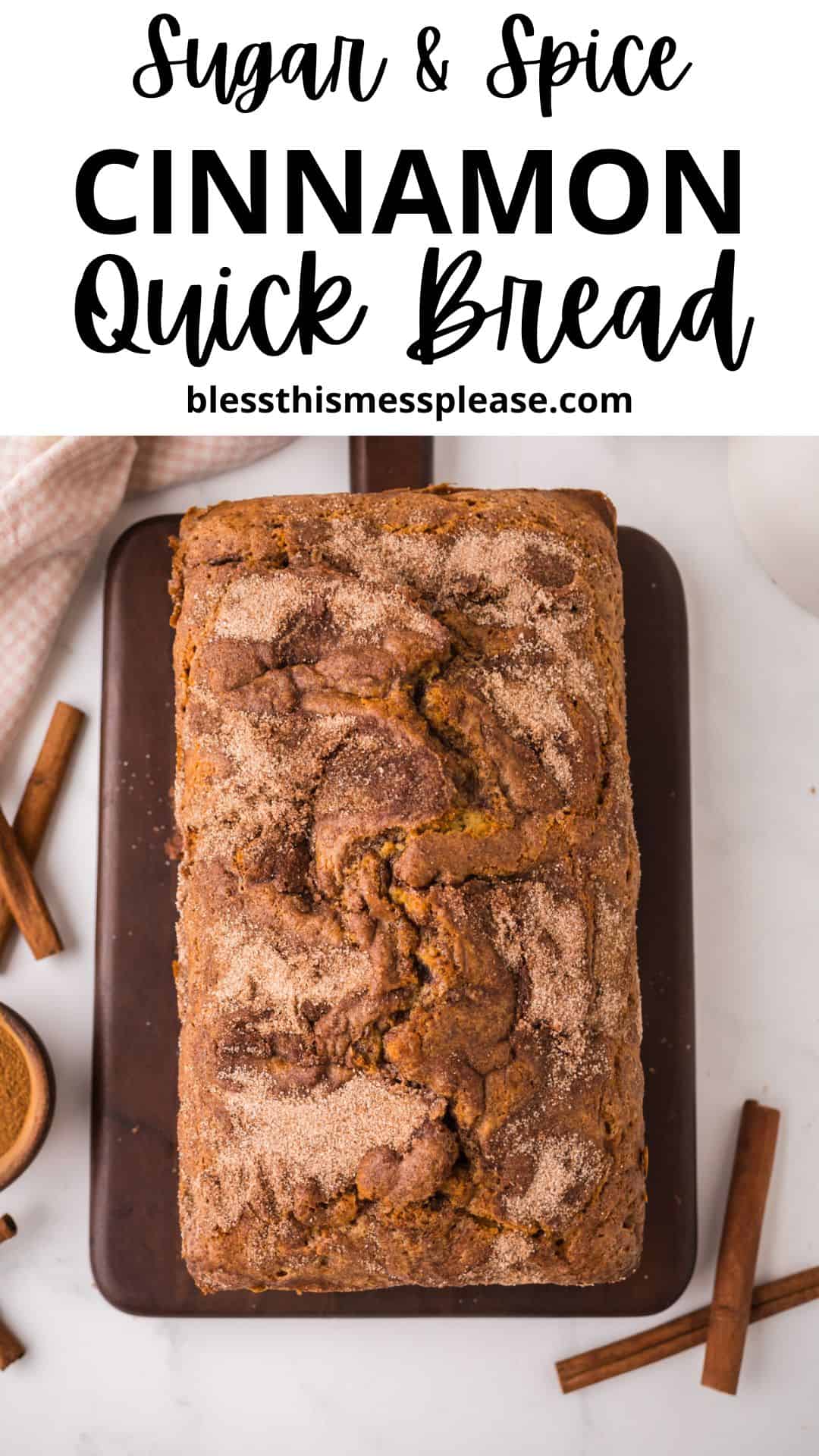 A loaf of cinnamon bread with a swirled, sugary crust sits on a wooden board, surrounded by cinnamon sticks and a pink checkered cloth. Text above reads: Sugar & Spice Cinnamon Quick Bread.