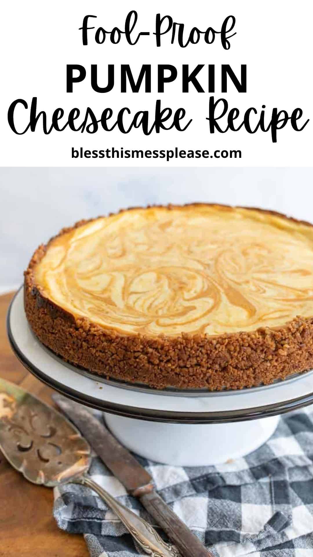 A pumpkin cheesecake with a marbled top and crumbly crust sits on a white cake stand, beside a vintage pie server and knife on a checkered cloth. Text above reads: Fool-Proof Pumpkin Cheesecake Recipe—your go-to pumpkin cheesecake recipe.