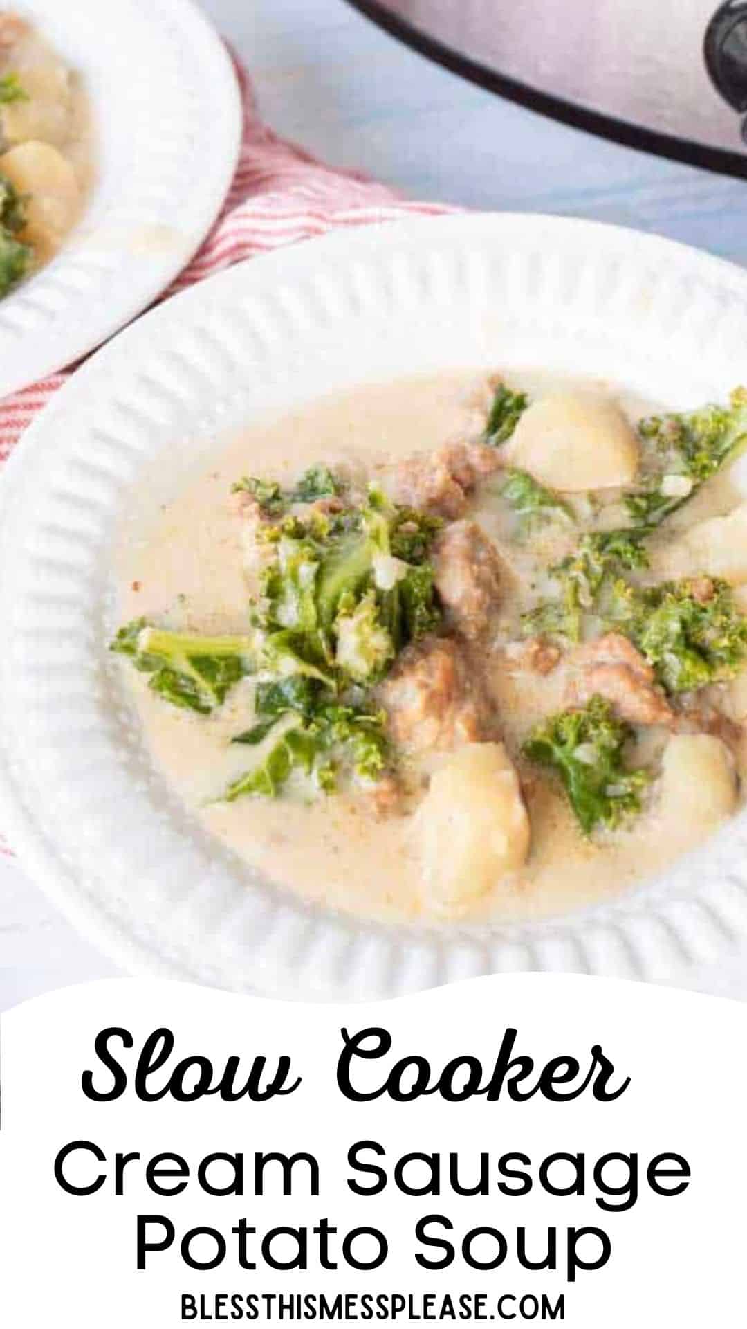A white plate filled with creamy sausage potato soup, brimming with sausage and leafy greens, sits on a white surface. The text at the bottom reads: Slow Cooker Cream Sausage Potato Soup blessthismessplease.com.
