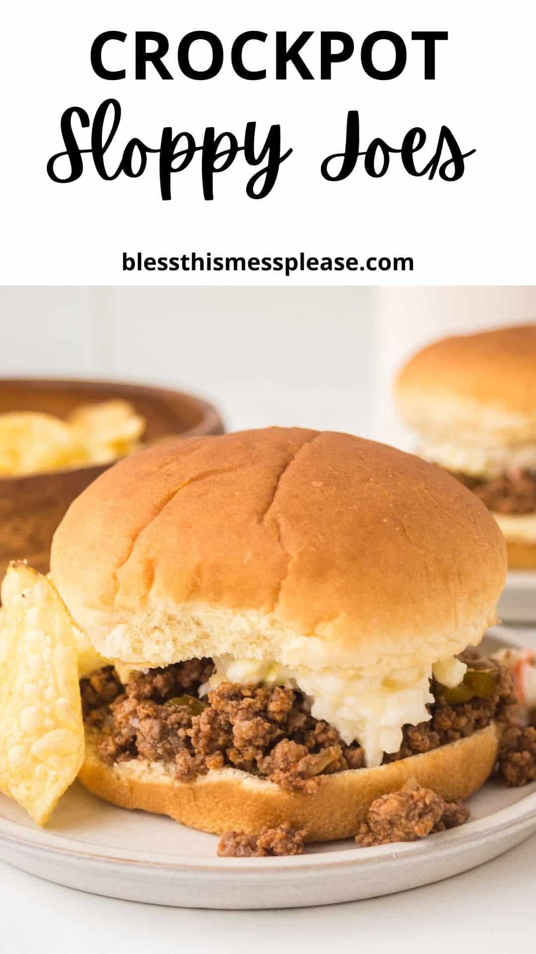 A crock pot sloppy joes sandwich sits on a plate with crispy potato chips, topped with hearty ground meat and what looks like shredded cheese or cabbage. Another sandwich and sides blur in the background. Text above reads Crockpot Sloppy Joes.