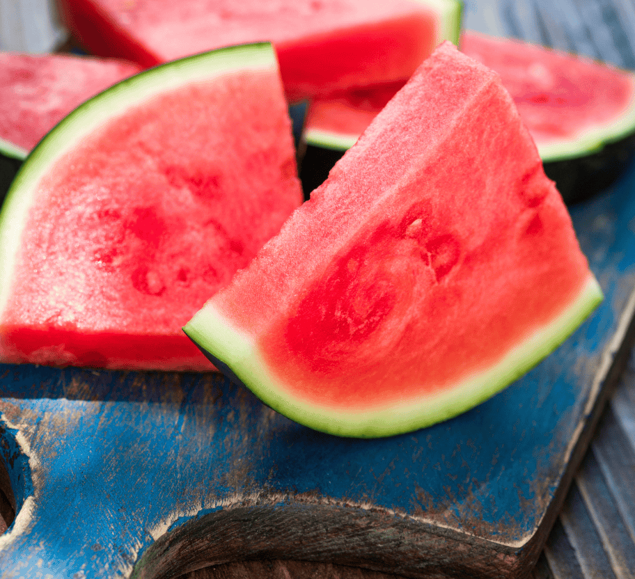 Sliced watermelon on a blue cutting board, above a photo of a whole watermelon growing on a vine among green leaves and rocks—perfect visuals for learning how to preserve watermelon at its freshest.