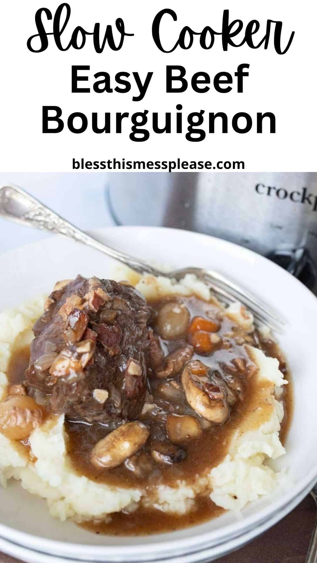A plate of mashed potatoes topped with slow cooker beef bourguignon—tender beef, carrots, mushrooms, and rich sauce—sits in front of a slow cooker. Text above reads: Slow Cooker Easy Beef Bourguignon blessthismessplease.com.