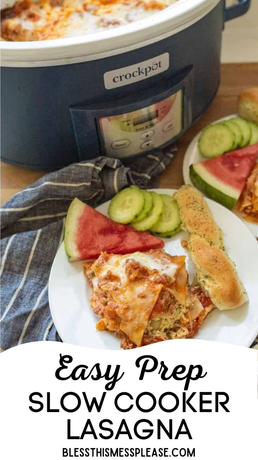 A plate with a slice of slow cooker lasagna, watermelon, cucumber slices, and a breadstick sits before a slow cooker brimming with lasagna. Text reads: “Easy Prep Slow Cooker Lasagna. blessthismessplease.com”.