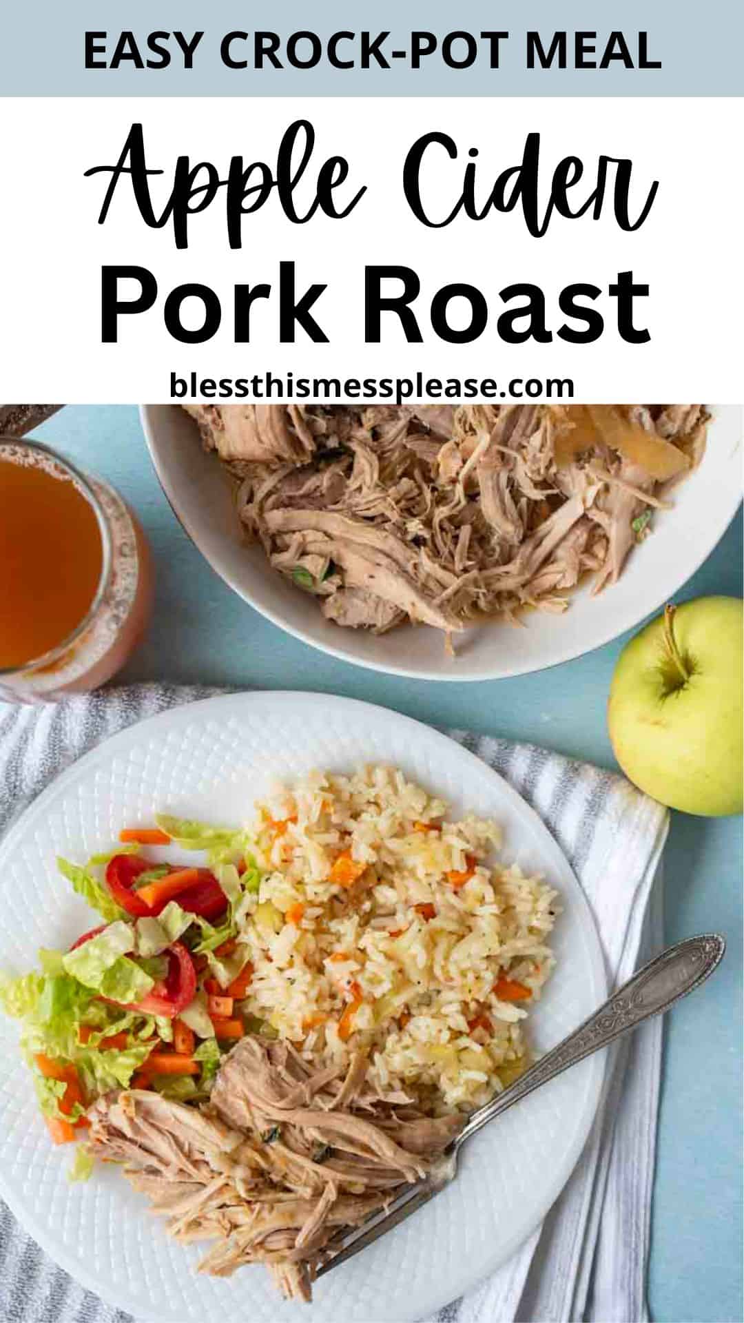 A plate with slow cooker pork roast, rice, and salad sits next to a fork, an apple, a glass of apple cider, and a bowl of more shredded pork on a blue surface. Text reads, Apple Cider Pork Roast.