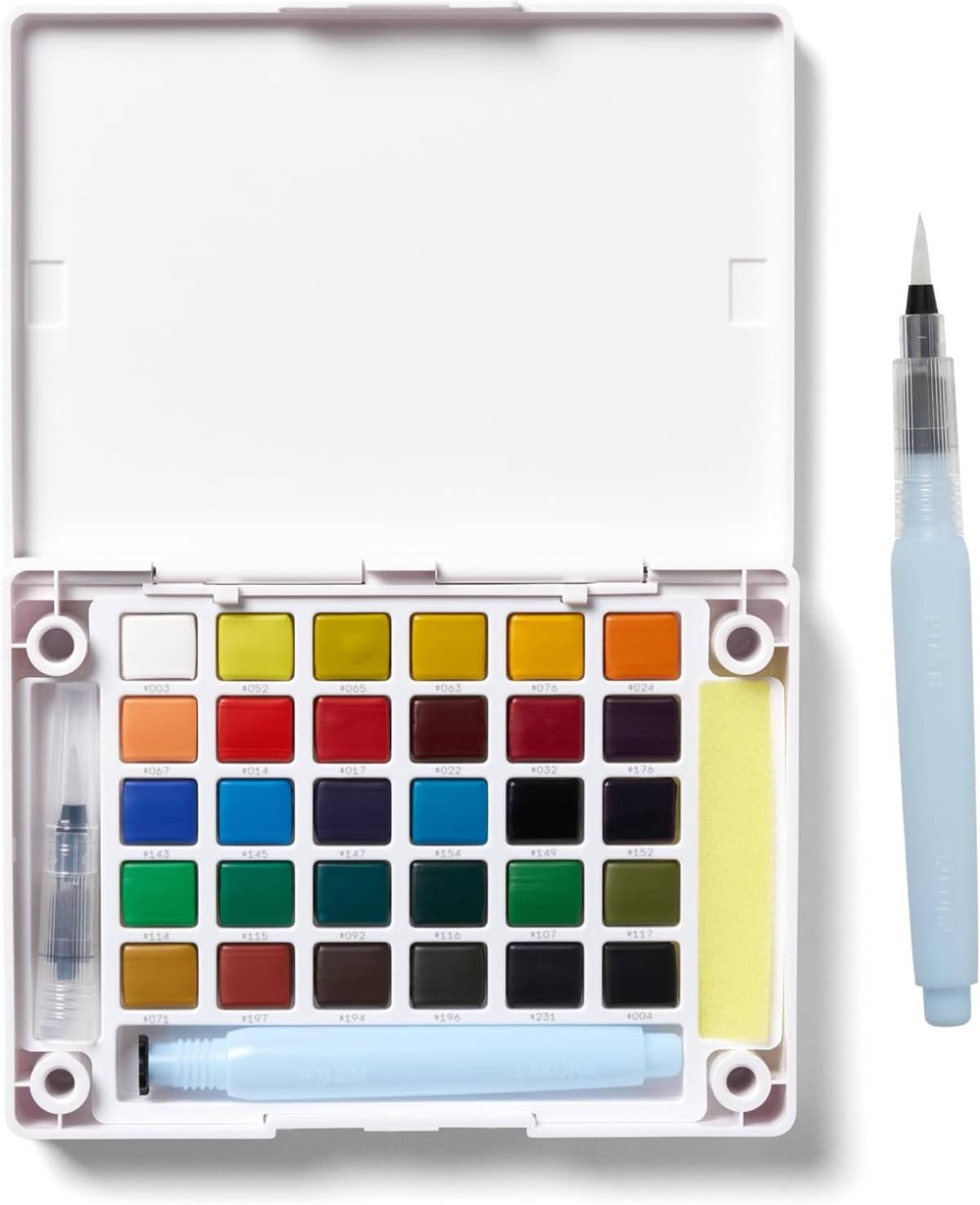 An open watercolor paint set with 24 colorful paint pans, a water brush pen, a sponge, and a water container pen inside a white plastic case. Another brush pen is placed to the right of the case.