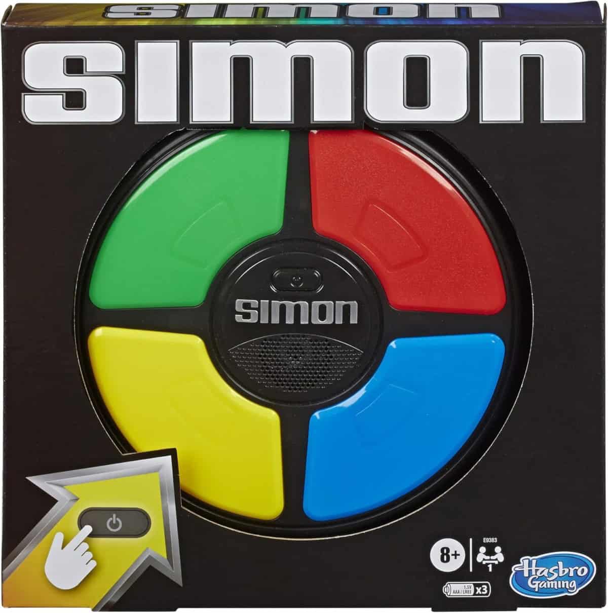 The image shows the box for the Simon electronic memory game, featuring a circular device with green, red, yellow, and blue colored buttons, and the Simon logo at the center. The Hasbro Gaming logo is in the bottom right corner.