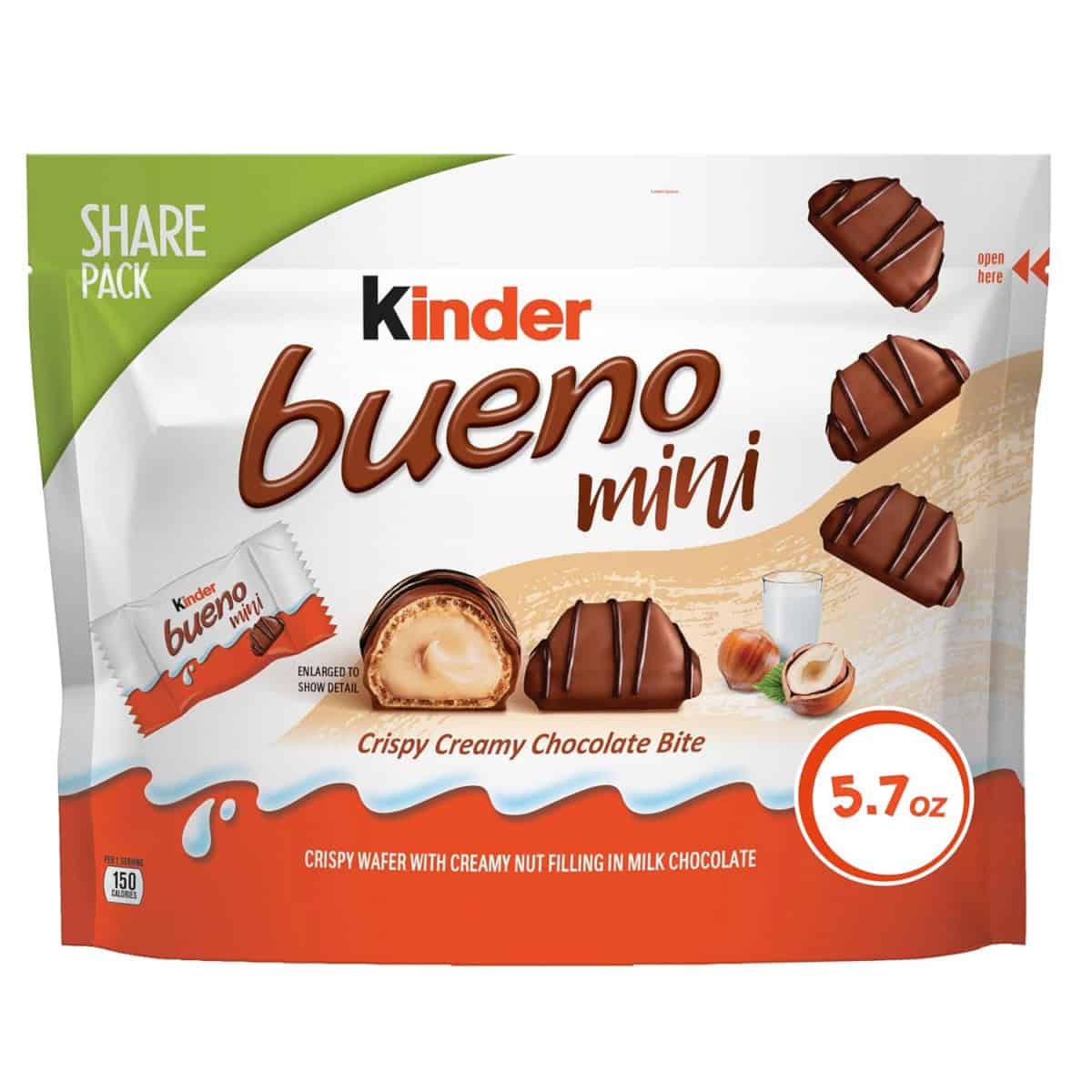 Front of a 5.7 oz share pack of Kinder Bueno Mini chocolates, showing chocolate pieces, creamy filling, a glass of milk, and hazelnuts on the packaging. Text highlights crispy creamy chocolate bite.