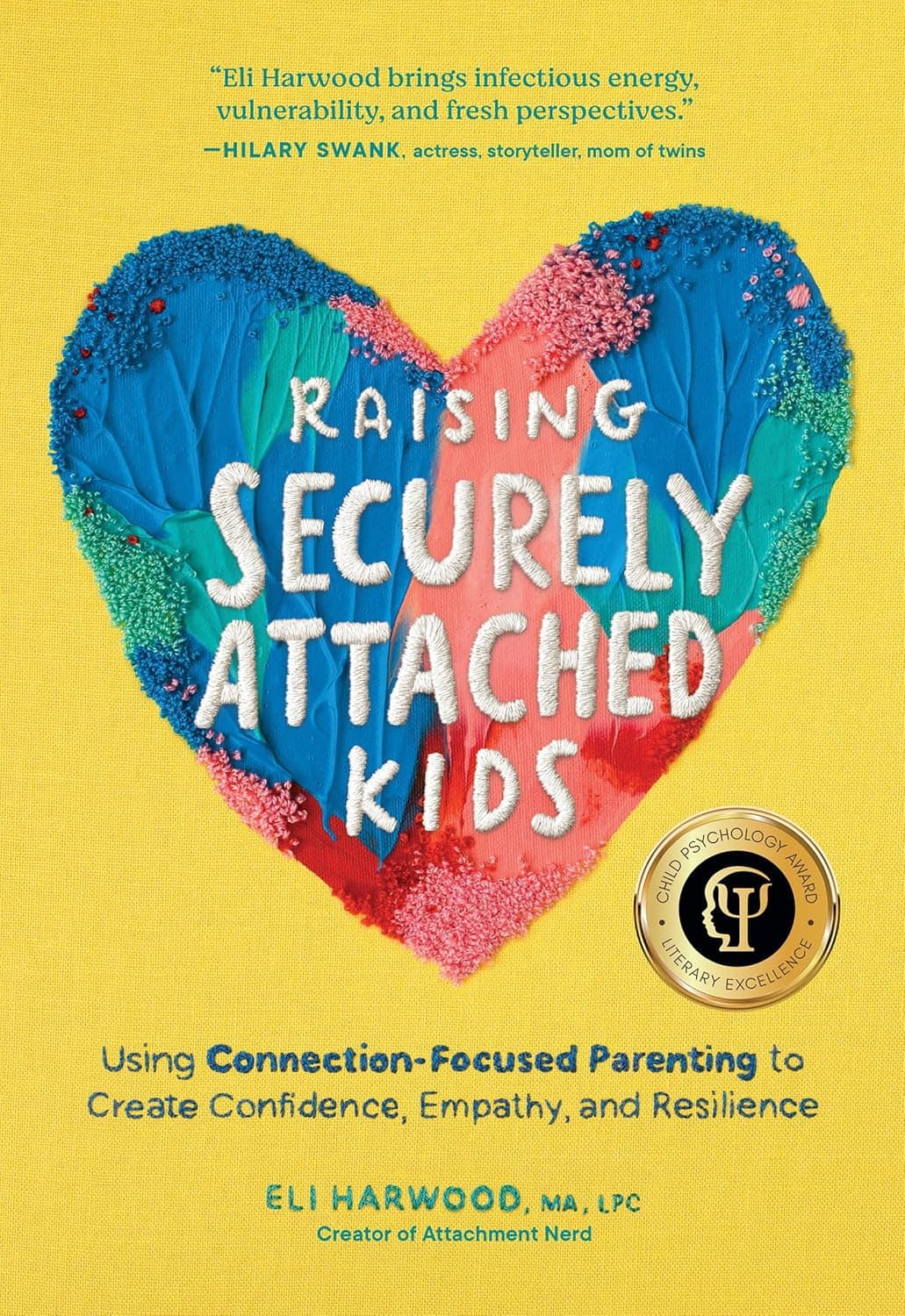 Book cover with a heart made of blue, green, and red clay. Inside the heart, white clay letters spell Raising Securely Attached Kids. Below, yellow text promotes connection-focused parenting. Gold psychology award badge is on the right.
