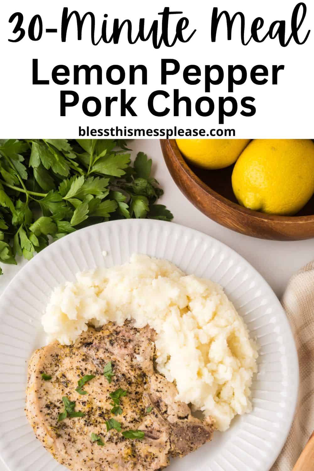 A plate with lemon pepper pork chops and mashed potatoes, garnished with parsley. Fresh parsley and lemons are nearby. Text above reads: 30-Minute Meal Lemon Pepper Pork Chops blessthismessplease.com.