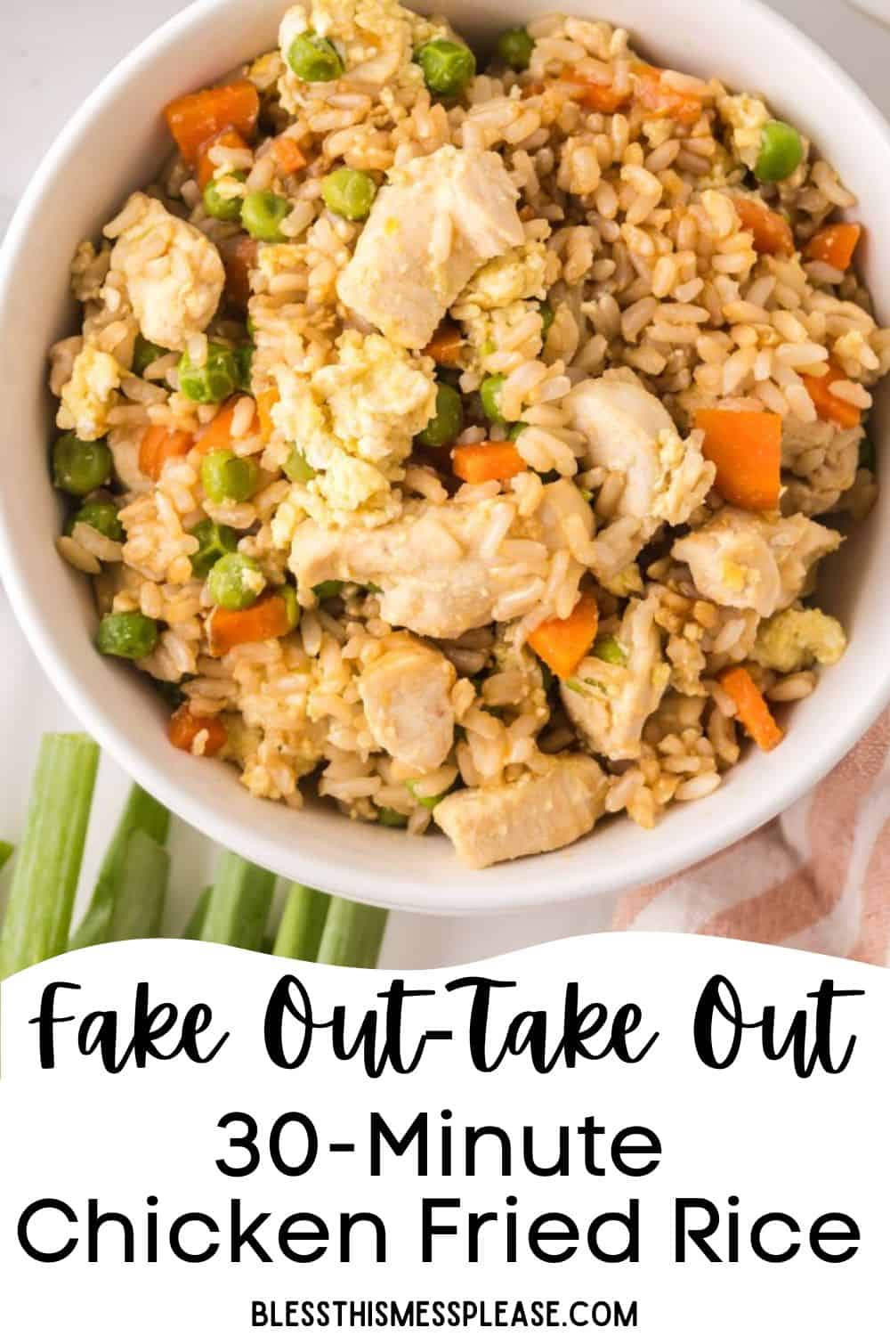 A bowl of chicken fried rice with peas, carrots, eggs, and rice on a light surface, featuring text overlay: Fake Out-Take Out 30-Minute Chicken Fried Rice—perfect for making chicken fried rice at home. blessthismessplease.com.
