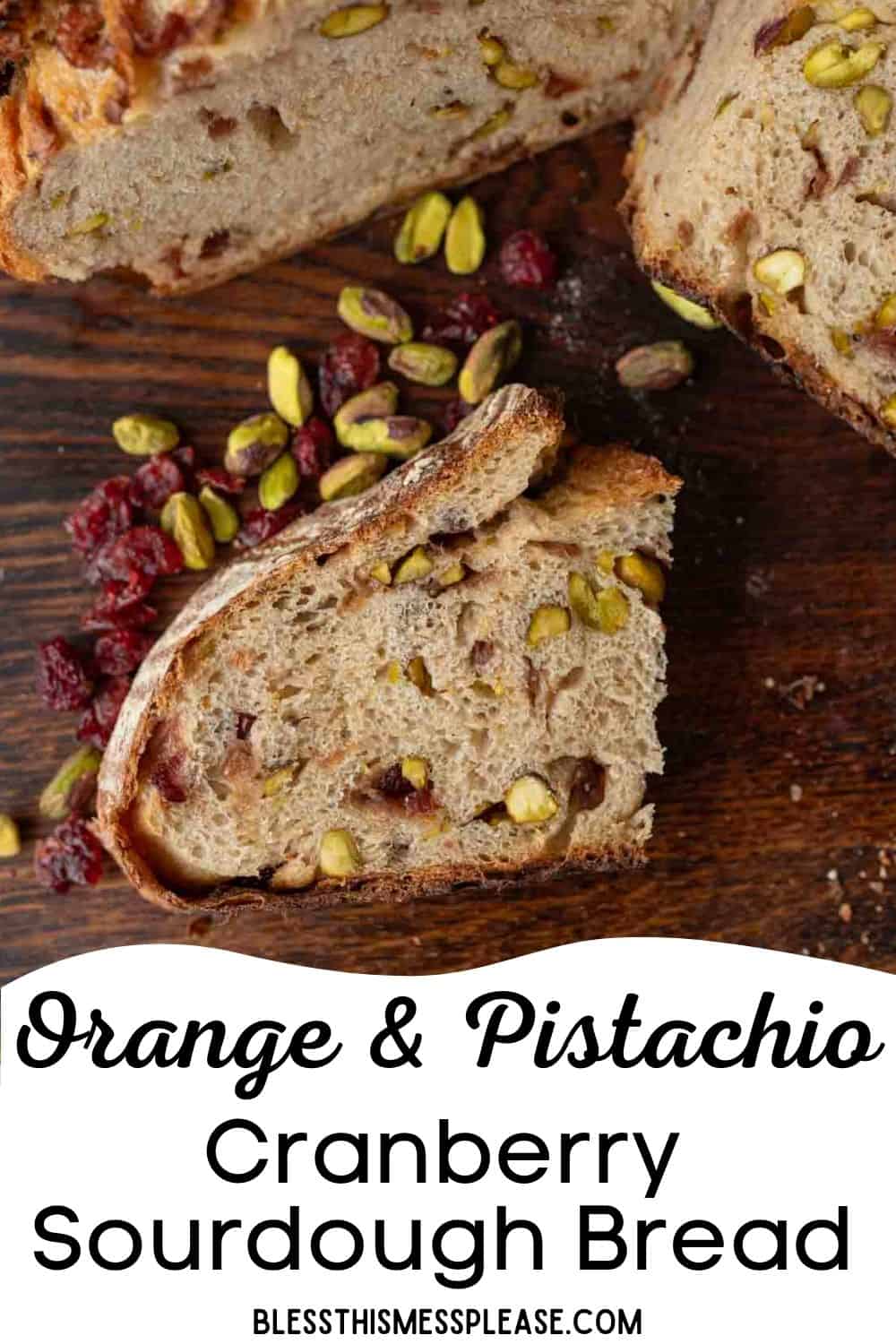 A sliced loaf of cranberry sourdough bread with visible pistachios and cranberries rests on a wooden surface, surrounded by loose pistachios and dried cranberries. Text reads: Orange & Pistachio Cranberry Sourdough Bread.