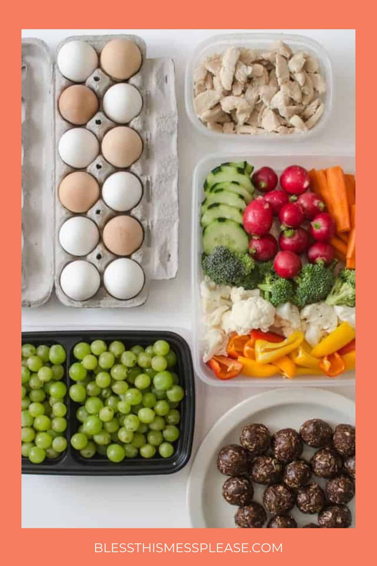 A variety of healthy foods are arranged on a table, including eggs, cooked chicken strips, sliced vegetables, grapes, and round chocolate snack balls. The image has an orange border and the website blessthismessplease.com at the bottom.