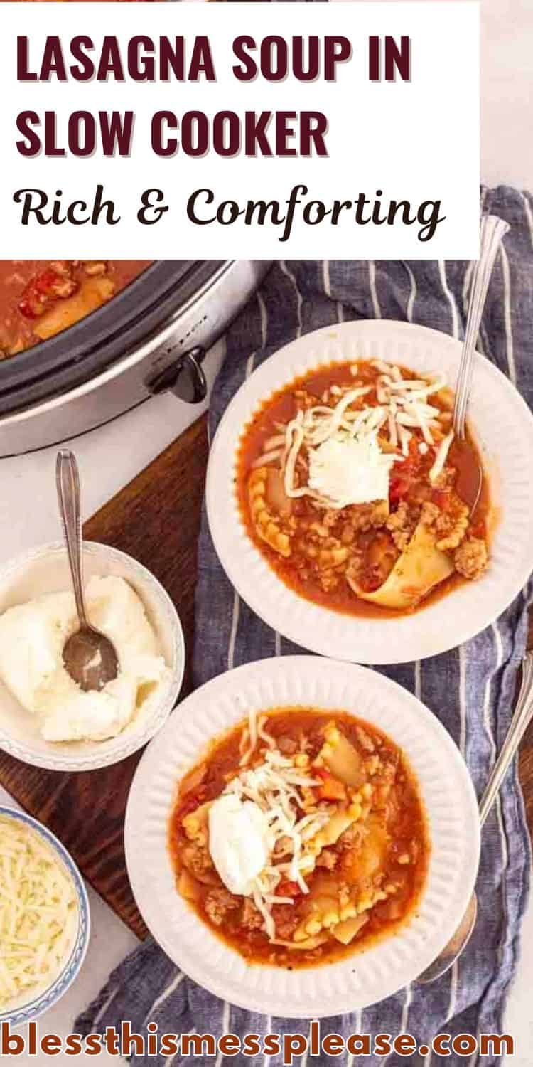 Overhead view of two bowls of lasagna soup in slow cooker topped with cheese and sour cream, next to a slow cooker and a bowl of ricotta. The text reads “Lasagna Soup in Slow Cooker: Rich & Comforting.”.