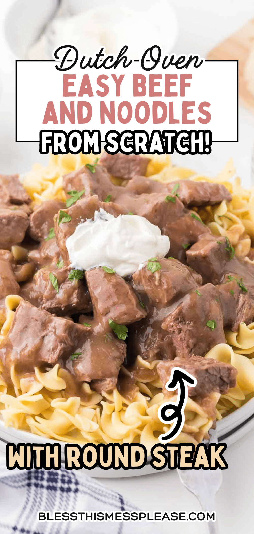 A plate of egg noodles topped with chunks of beef in gravy, garnished with parsley and sour cream. Text overlay: “Dutch-Oven Easy Round Steak Beef and Noodles Recipe from Scratch!”.